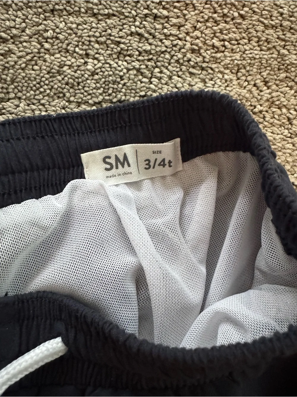 Toddler black swim Shorts with White Trim